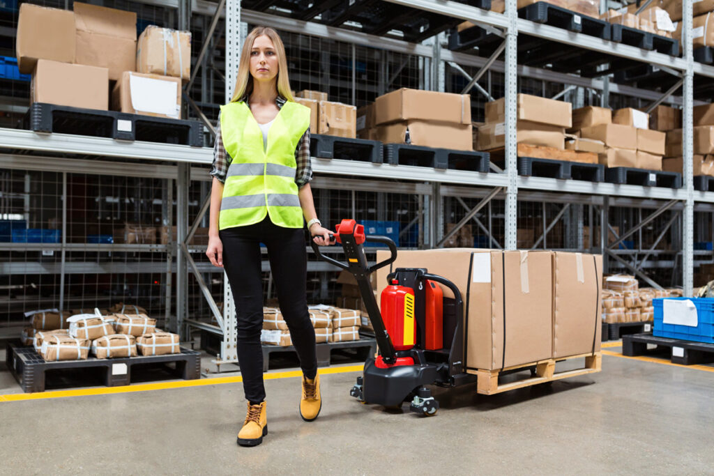 Woman with boxes in warehouse