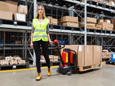 Woman with boxes in warehouse